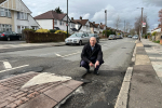 Jonathan Hulley by dangerous pothole on Powder Mill Lane in Whitton