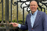 Jonathan Hulley, by locked entrance gate to the gardens