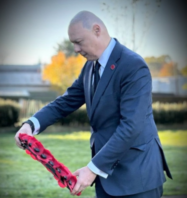 Jonathan Hulley laying a wreath on Remembrance Sunday