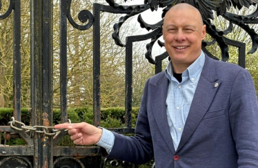 Jonathan Hulley, by locked entrance gate to the gardens